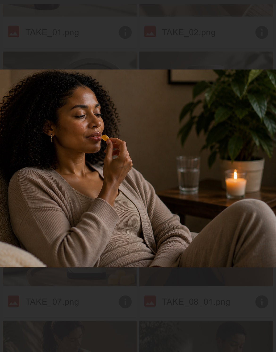 Woman relaxing on couch eating OSWL Nite Nurse mango CBD gummy by candlelight before bed